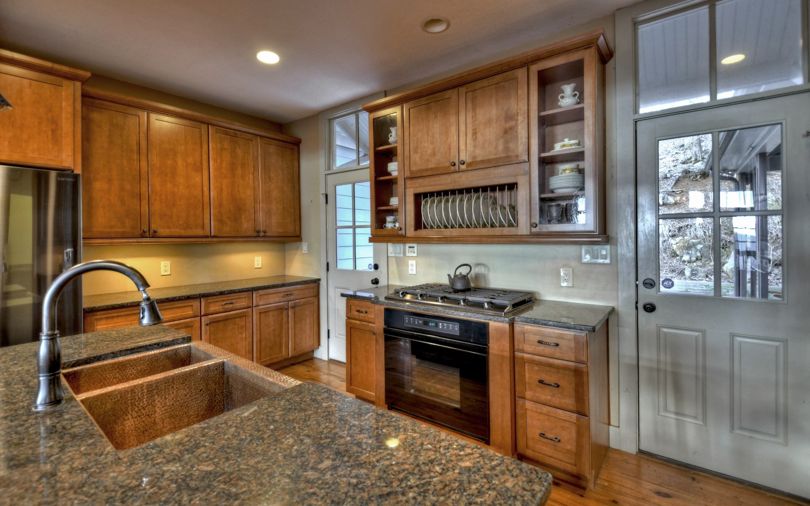 773 Heards Ridge Morganton, GA 30560 - Photo 17 of 54 a kitchen with stainless steel appliances granite countertop a stove a sink and a microwave