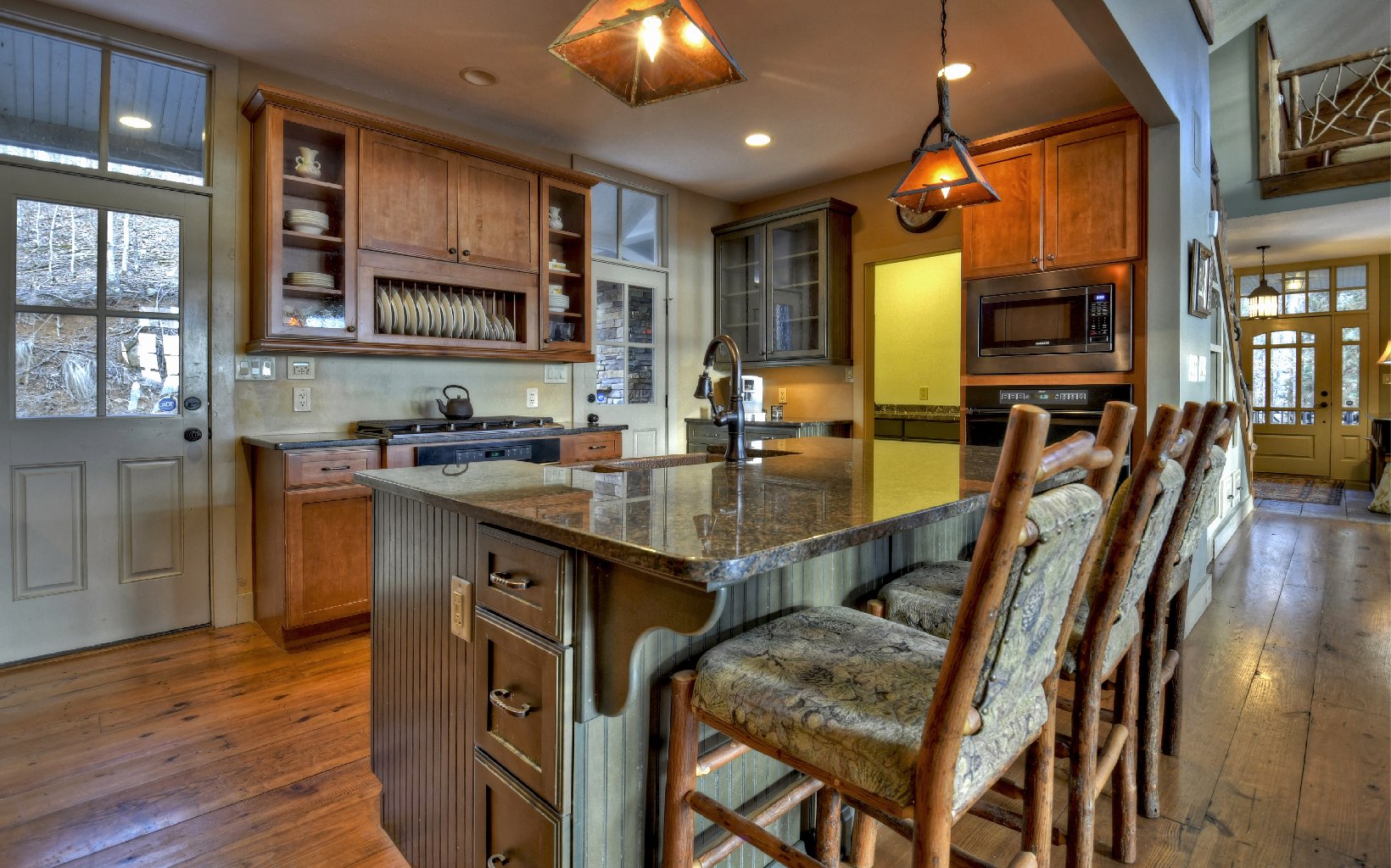 773 Heards Ridge Morganton, GA 30560 - Photo 19 of 54 a kitchen with stainless steel appliances granite countertop a sink a stove and a wooden floors