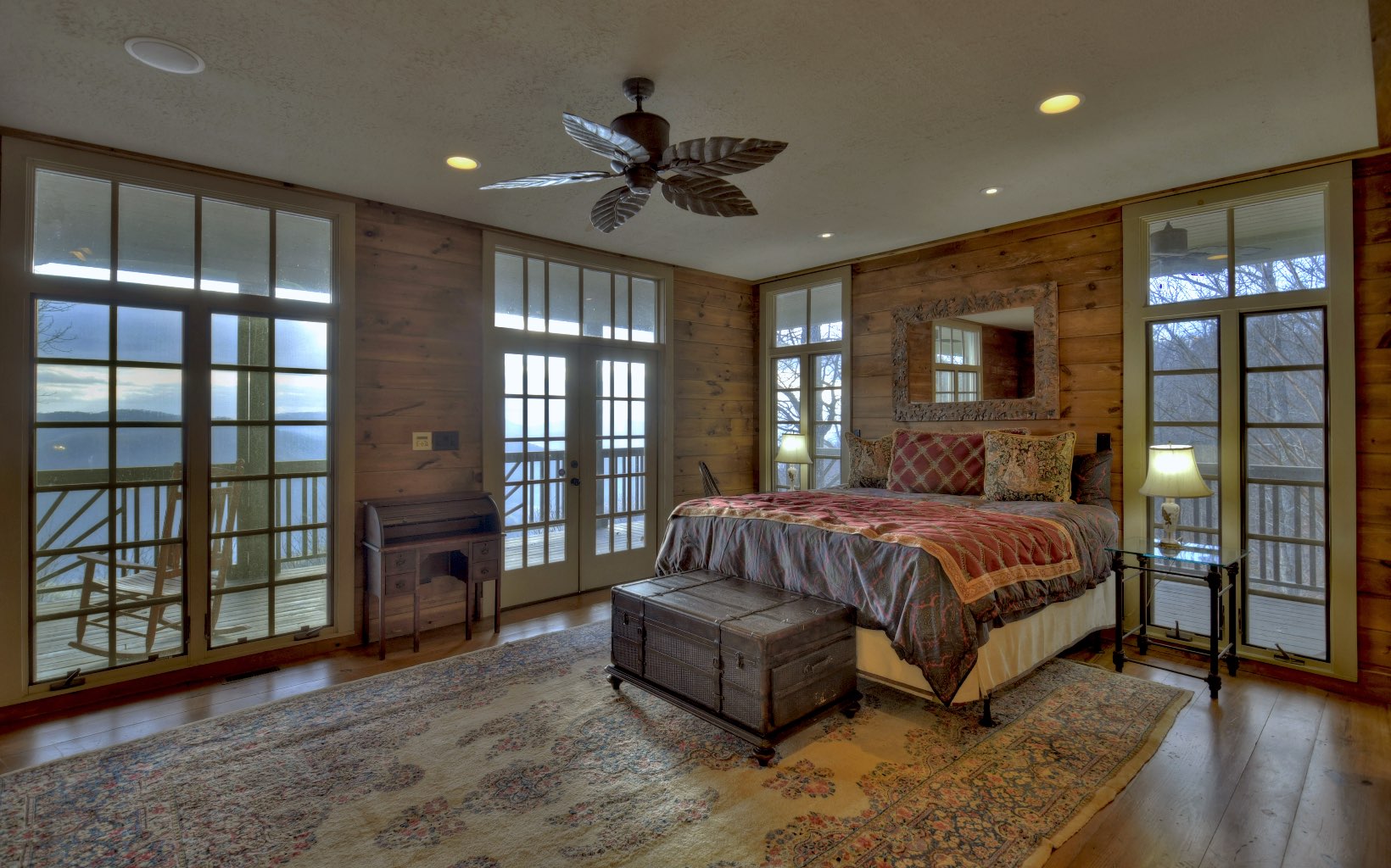 773 Heards Ridge Morganton, GA 30560 - Photo 25 of 54 a spacious bedroom with a large bed and a chandelier
