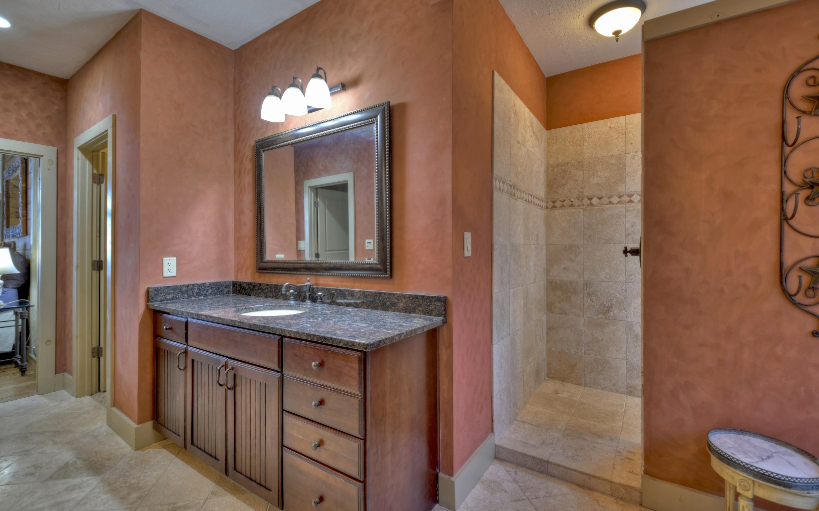 773 Heards Ridge Morganton, GA 30560 - Photo 34 of 54 a bathroom with a granite countertop sink a toilet and a mirror