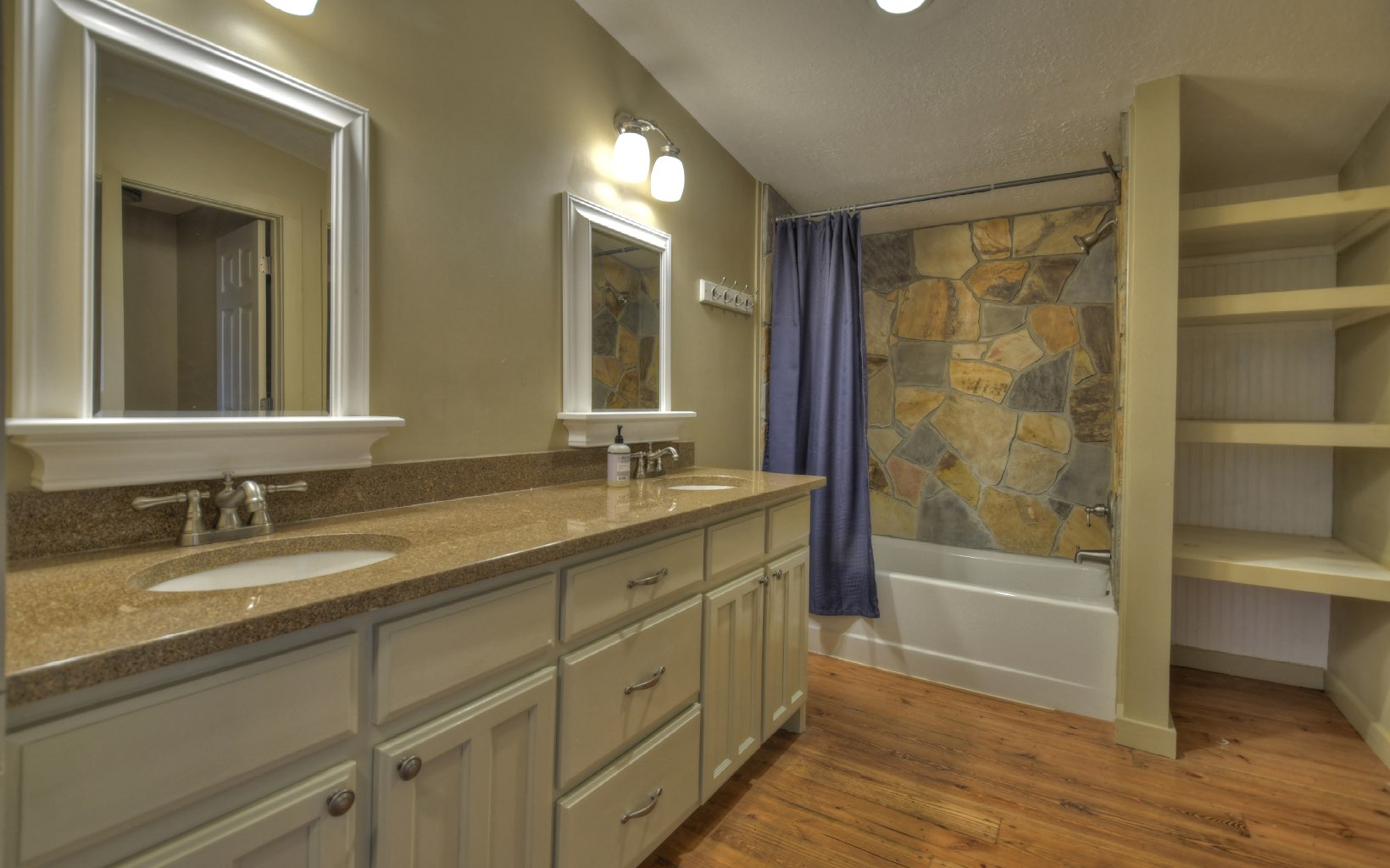 773 Heards Ridge Morganton, GA 30560 - Photo 46 of 54 a bathroom with a granite countertop sink mirror bathtub and double