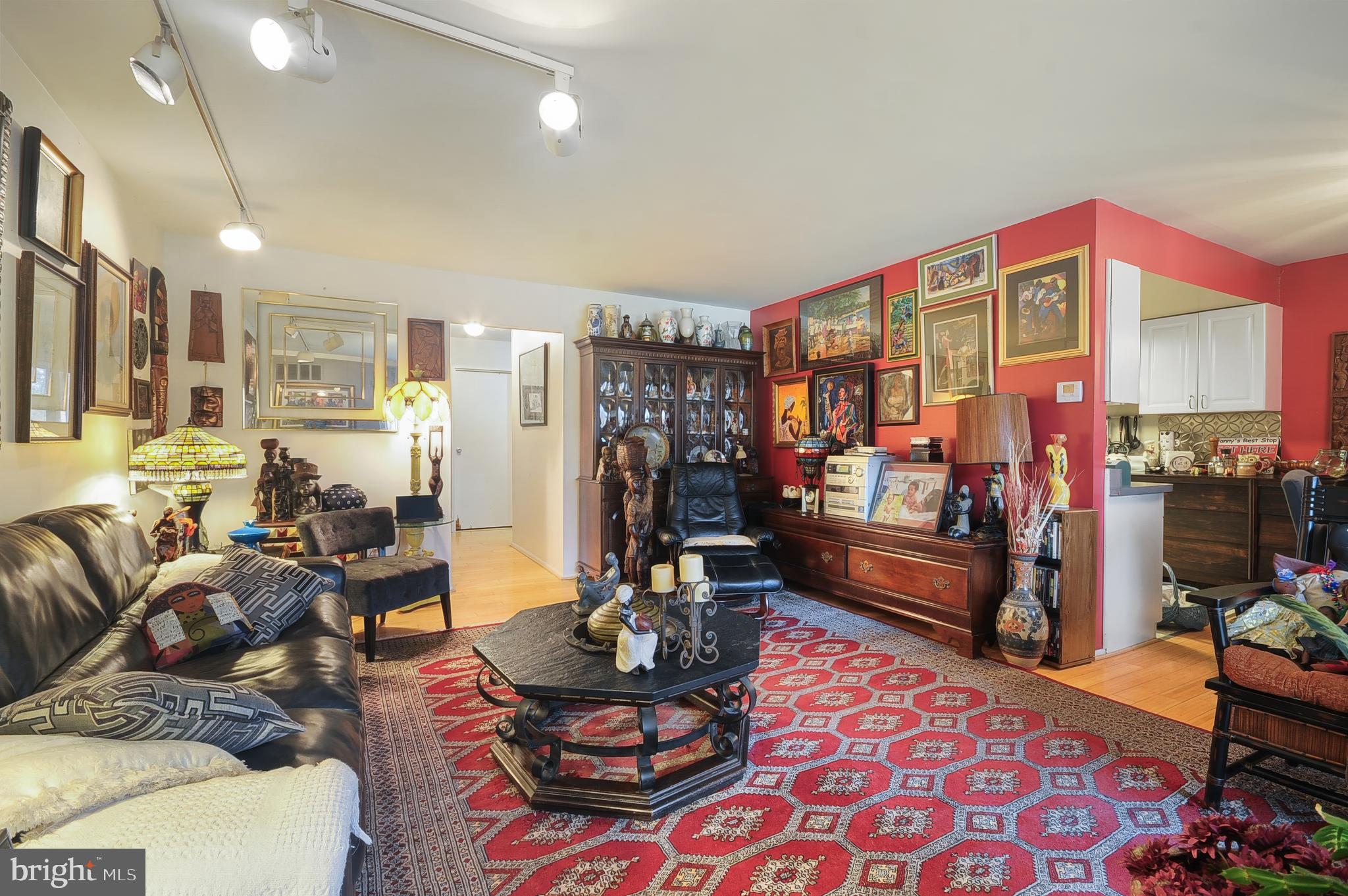 7300 Cresheim Road, Unit C13 Philadelphia, PA 19119 - Photo 15 of 26 a living room with furniture a rug and a chandelier