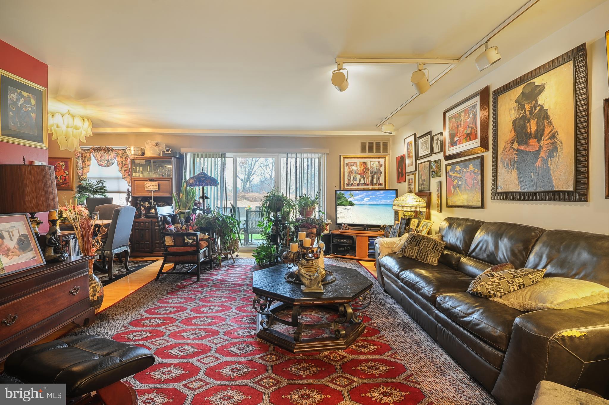 7300 Cresheim Road, Unit C13 Philadelphia, PA 19119 - Photo 16 of 26 a living room with furniture fireplace and a large window