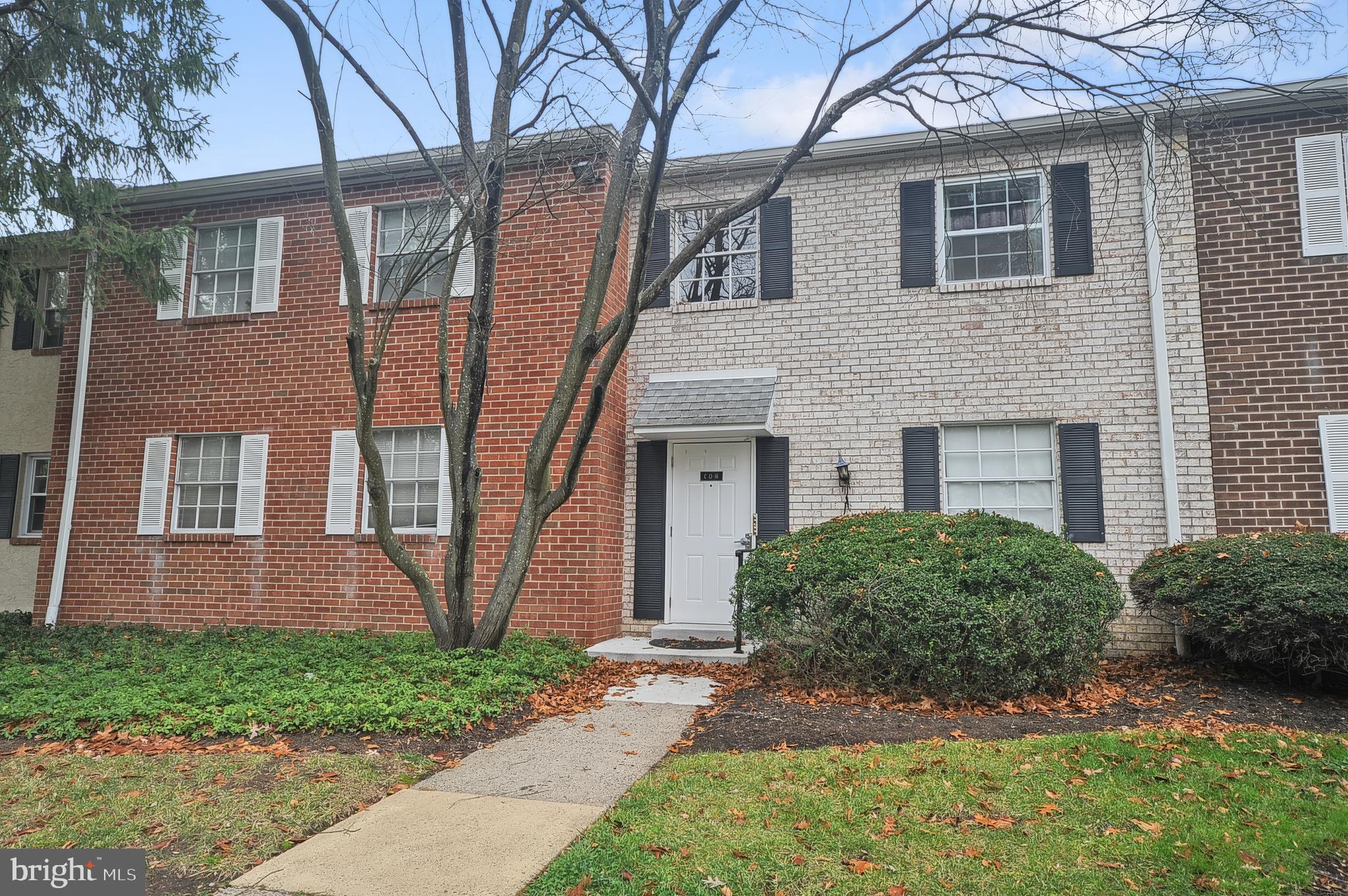 7300 Cresheim Road, Unit C13 Philadelphia, PA 19119 - Photo 3 of 26 a view of a brick house next to a yard
