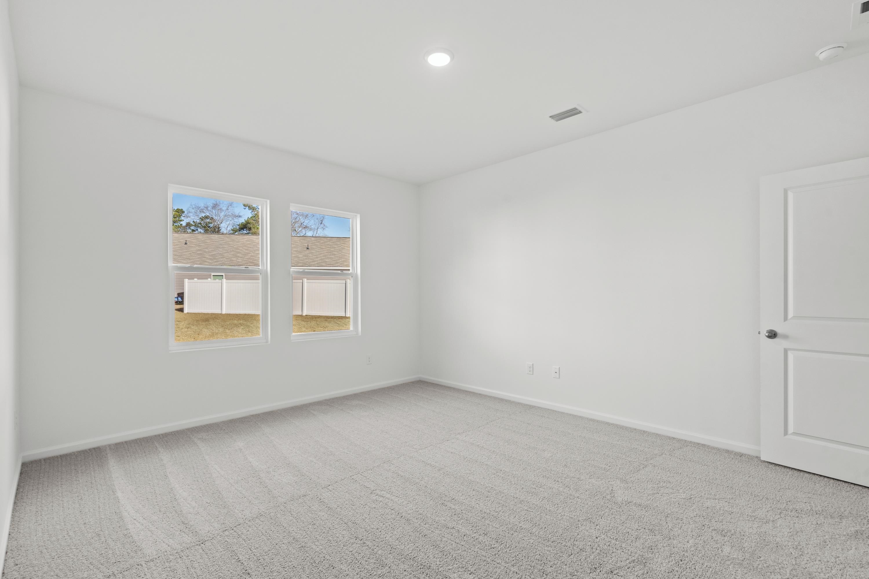 349 Sporting Drive Aynor, SC 29511 - Photo 17 of 31 Spare room featuring light carpet and recessed lighting