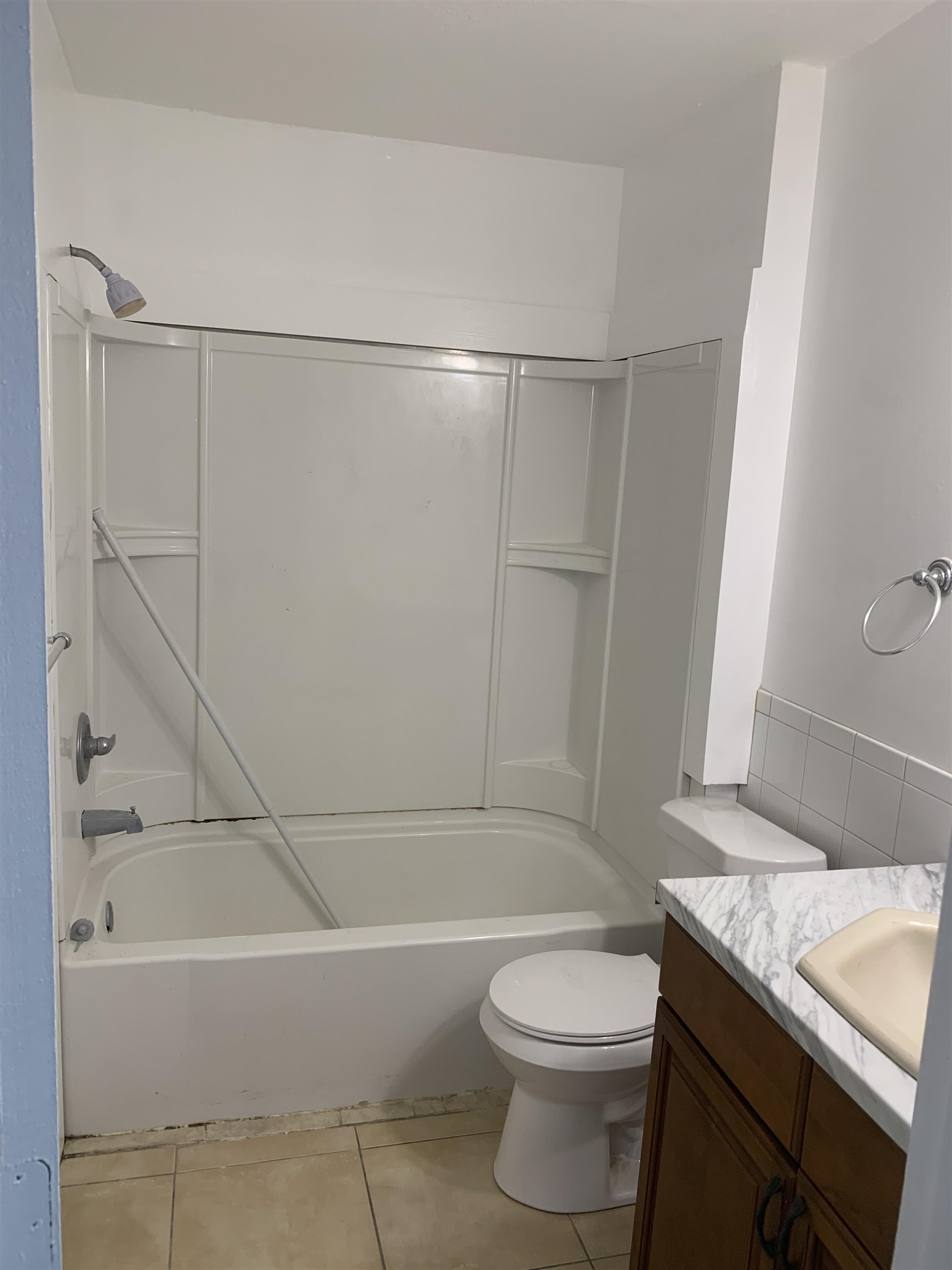 1845 Old Moultrie Road, Unit 30 St. Augustine, FL 32084 - Photo 4 of 15 a bathroom with a granite countertop sink toilet and shower
