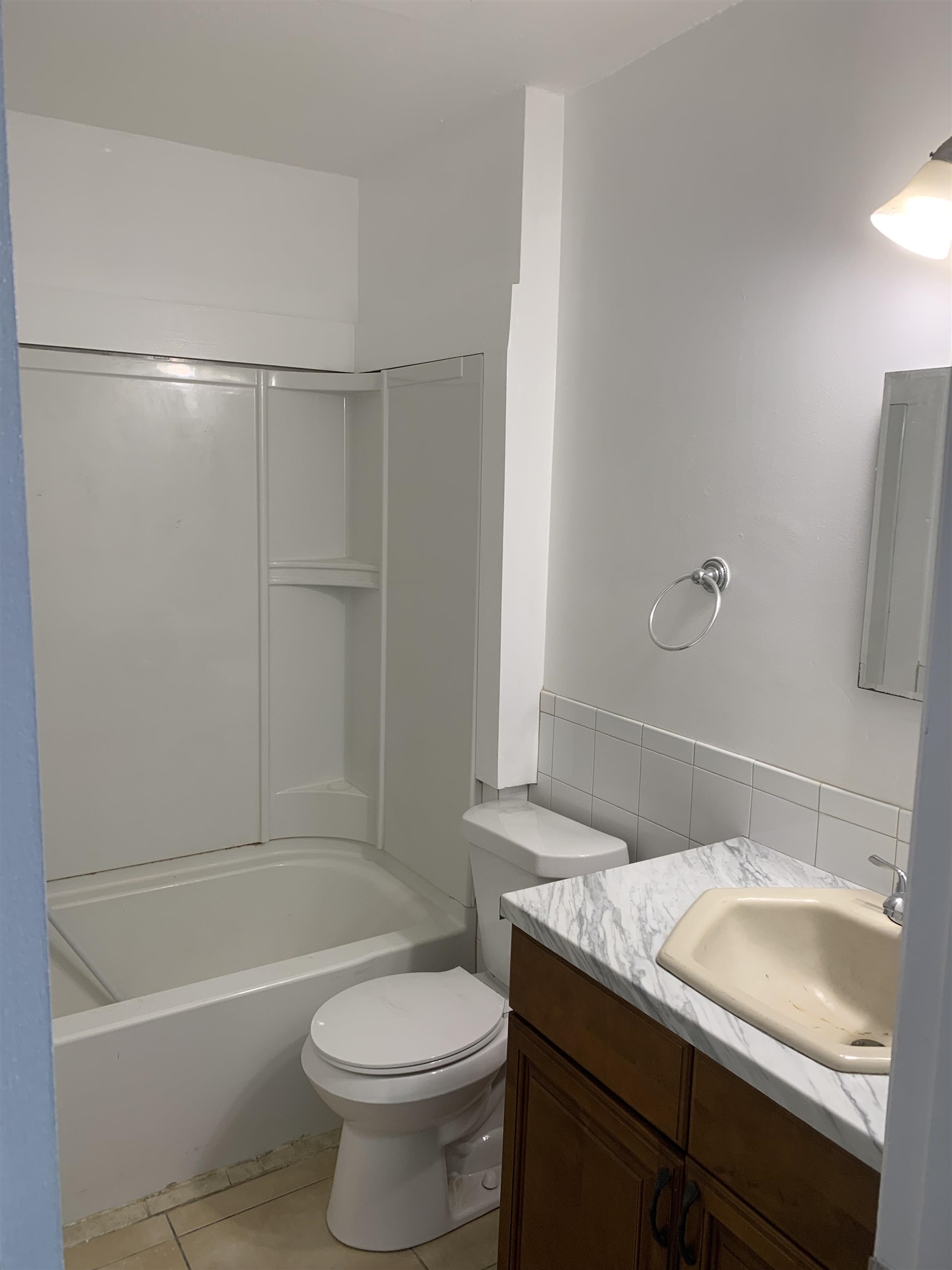 1845 Old Moultrie Road, Unit 30 St. Augustine, FL 32084 - Photo 6 of 15 a bathroom with a granite countertop sink toilet and shower