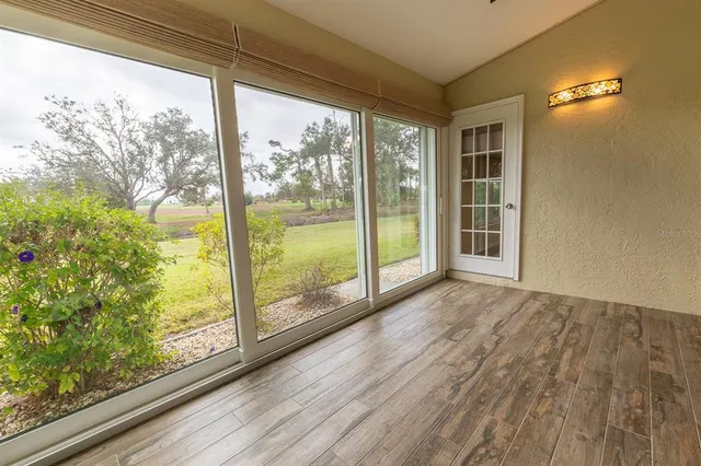 a view of a room with a large window