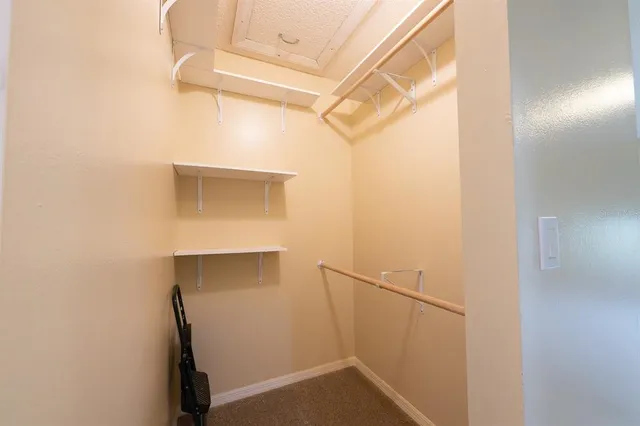 a bathroom with a granite countertop sink mirror and a shower