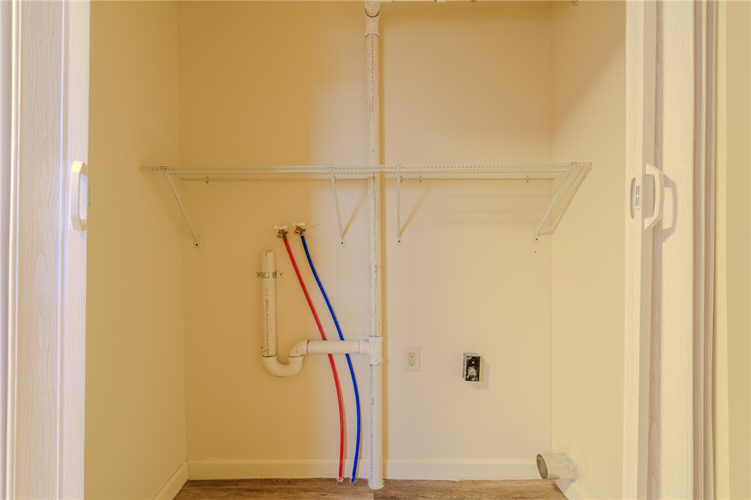 820 North 5th Street Allentown, PA 18102 - Photo 20 of 39 A dedicated laundry closet with essential hookups and convenient wire shelving.