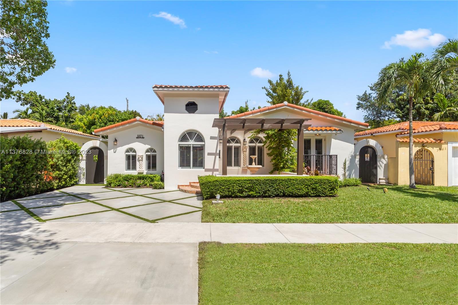 3371 Southwest 21st Street Miami, FL 33145 - Photo 1 of 23 a view of white house with a yard