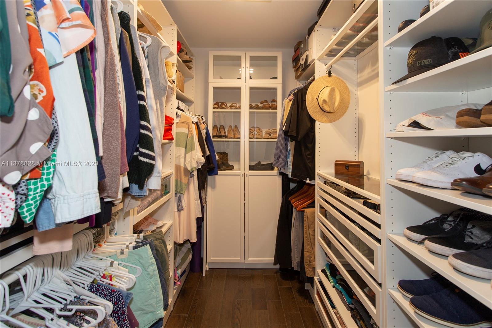 3371 Southwest 21st Street Miami, FL 33145 - Photo 20 of 23 a view of walk in closet with clothes and shoes