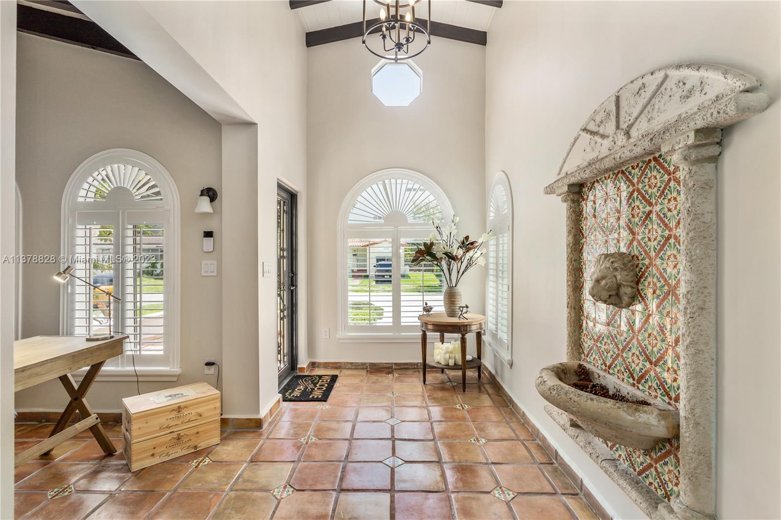 3371 Southwest 21st Street Miami, FL 33145 - Photo 4 of 23 a very nice looking room with a large window and chair
