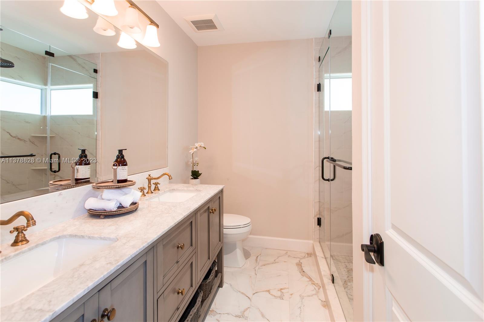3371 Southwest 21st Street Miami, FL 33145 - Photo 9 of 23 a bathroom with a sink a toilet and shower