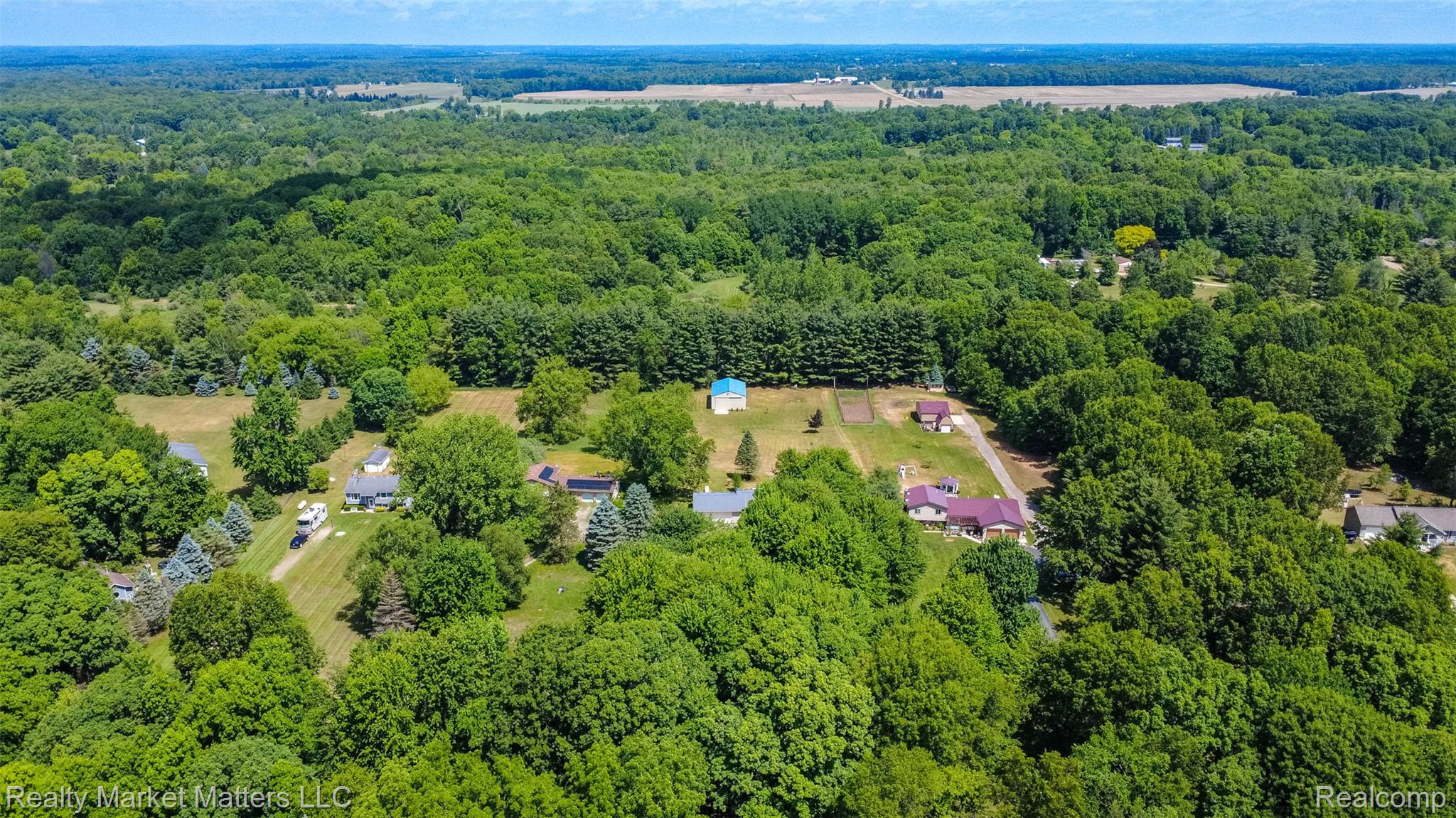 4951 Laur Road North Branch, MI 48461 - Photo 31 of 34 Expansive wooded setting featuring multiple residential properties