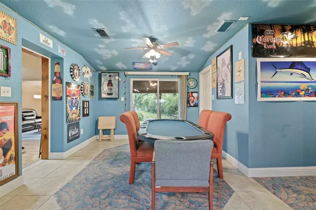 a dining room with furniture and window