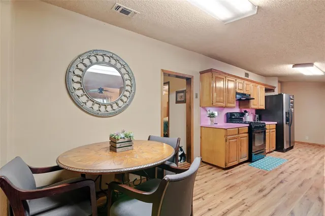 a view of a dining room with furniture and a livingroom