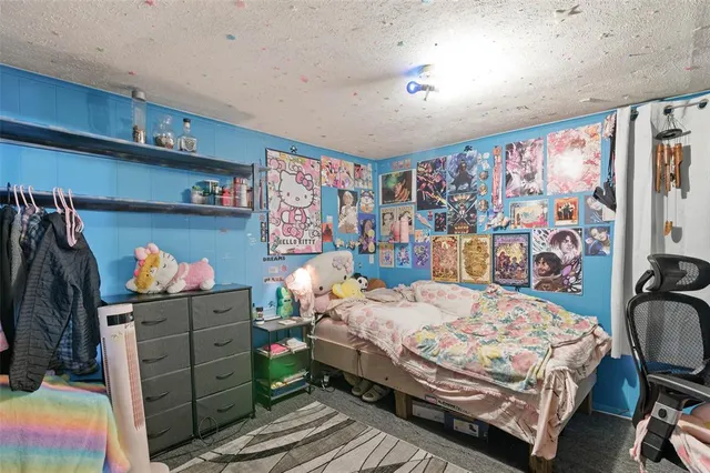 a bedroom with a bed and furniture