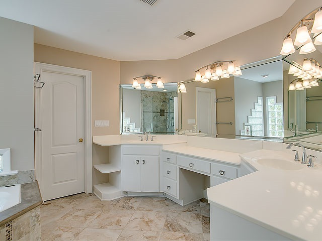 7905 Ogden Court Raleigh, NC 27613 - Photo 18 of 25 Many updates in Master bath- shower, tile, fixtures and plenty of space. Master Bath/Spa