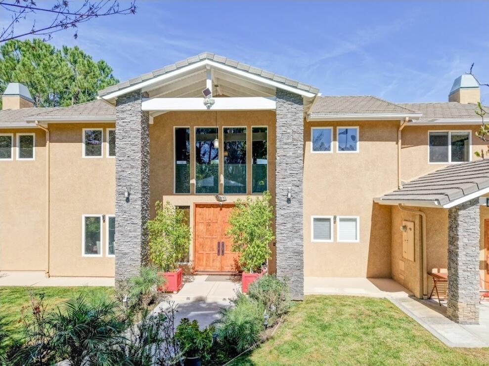 1377 Knoll Road Redlands, CA 92373 - Photo 1 of 28 front view of a house with a yard