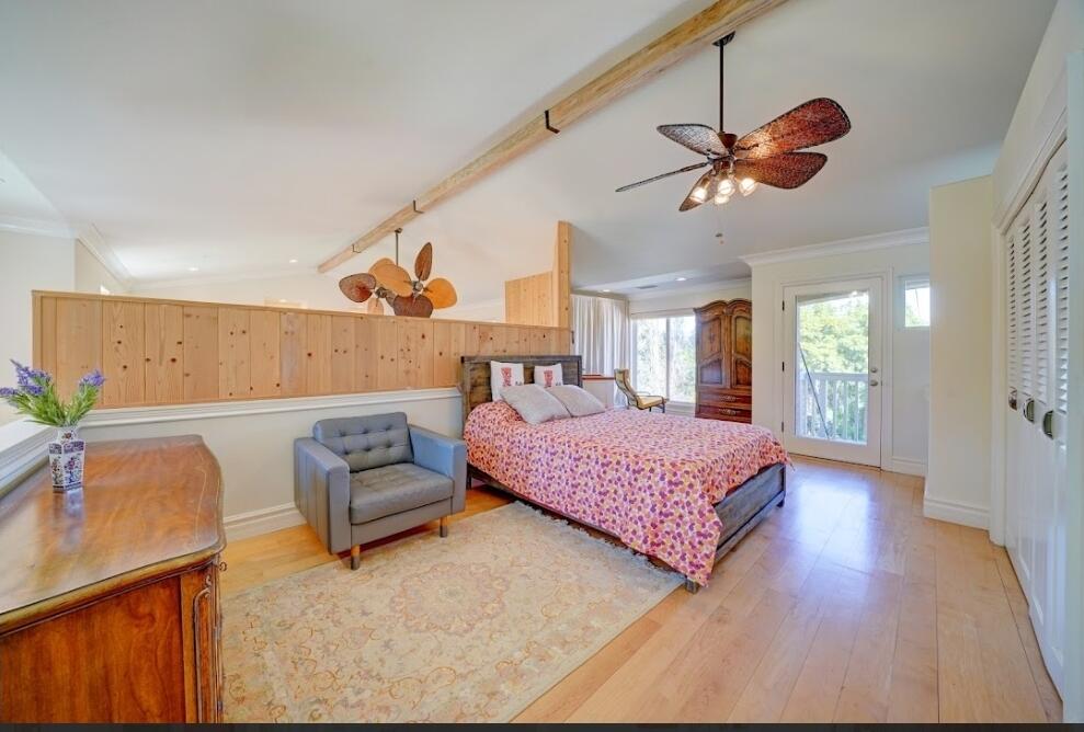 1377 Knoll Road Redlands, CA 92373 - Photo 6 of 28 a bedroom with a bed dresser and wooden floor