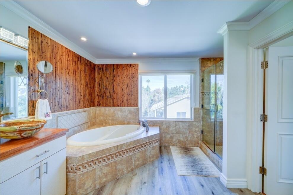 1377 Knoll Road Redlands, CA 92373 - Photo 10 of 28 a bathroom with a granite countertop sink a bathtub and next to a window