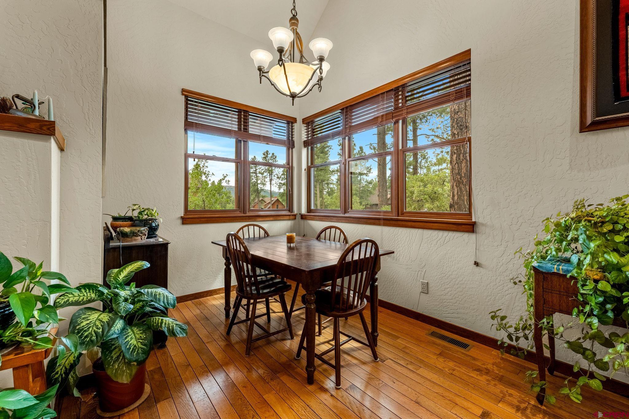 141 Red Canyon Trail, Unit E Durango, CO 81301 - Photo 13 of 42 a view of a dining room with furniture window and wooden floor