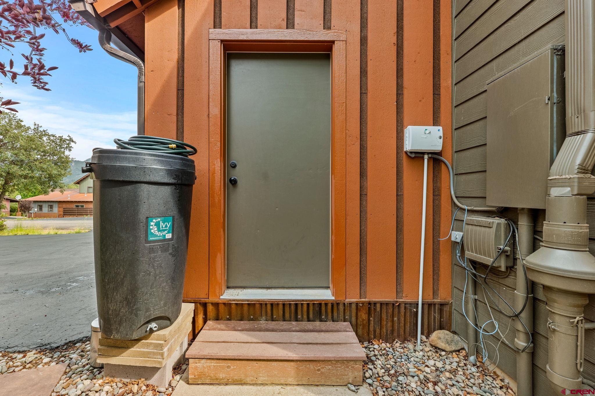 141 Red Canyon Trail, Unit E Durango, CO 81301 - Photo 37 of 42 a front view of a house with a yard