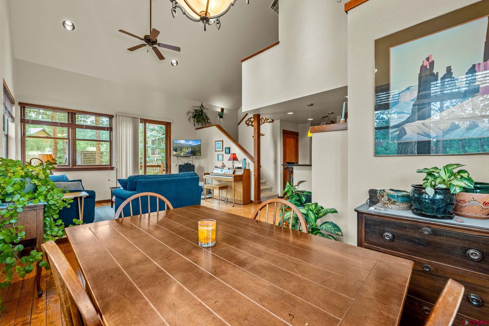141 Red Canyon Trail, Unit E Durango, CO 81301 - Photo 8 of 42 a view of a dining room with furniture and a potted plant