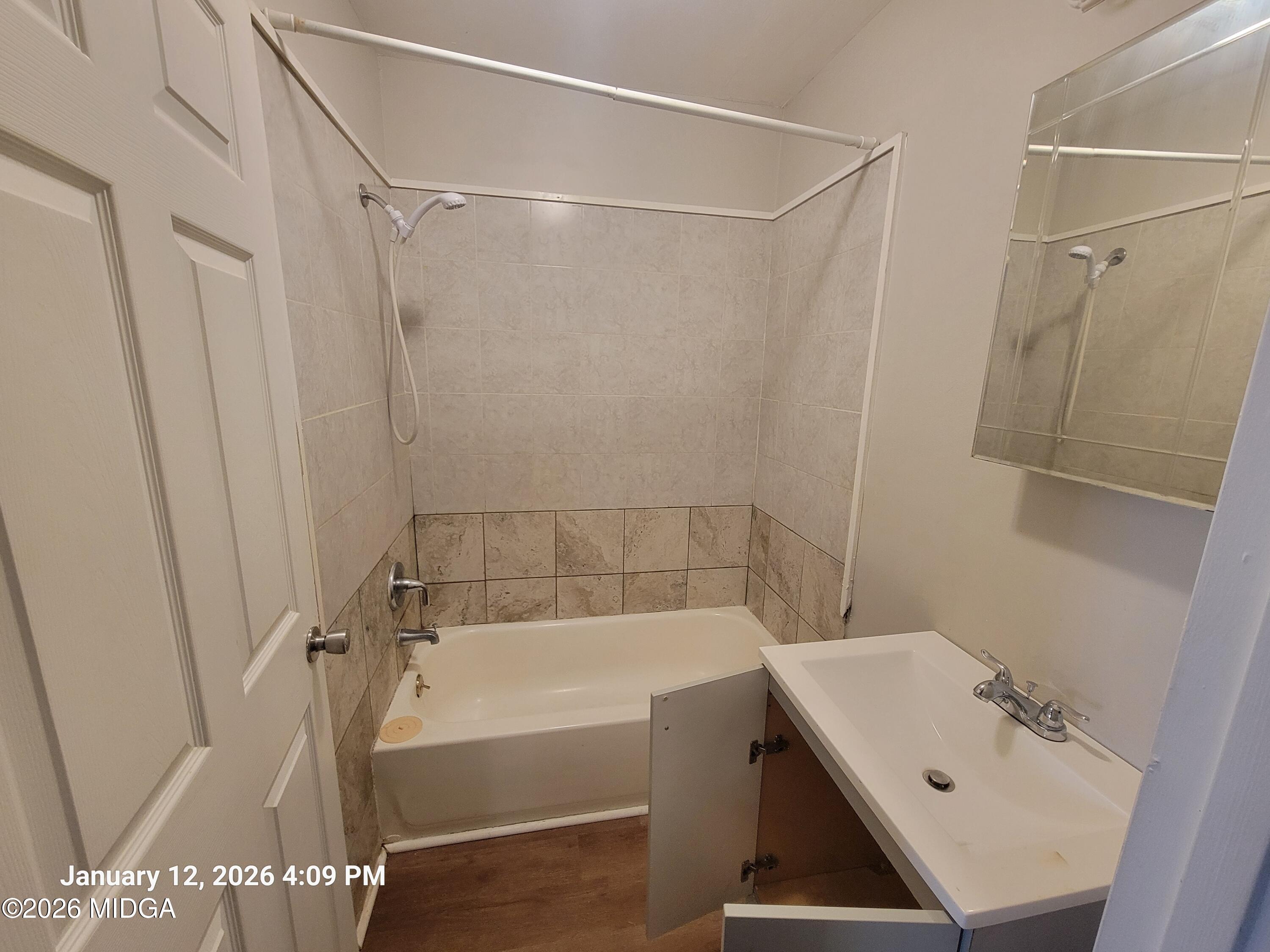 2872 Antioch Road Macon, GA 31206 - Photo 10 of 12 a bathroom with a bath tub and a shower