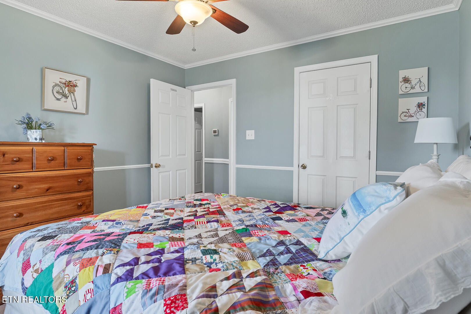 449 Foss Road Maryville, TN 37801 - Photo 35 of 49 a bedroom with a bed and a chandelier