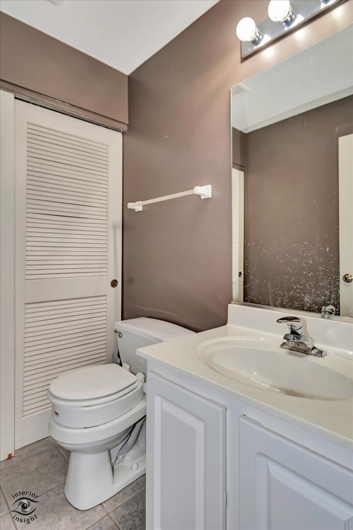 1831 South Wentworth Circle Romeoville, IL 60446 - Photo 12 of 23 a bathroom with a sink a toilet and shower