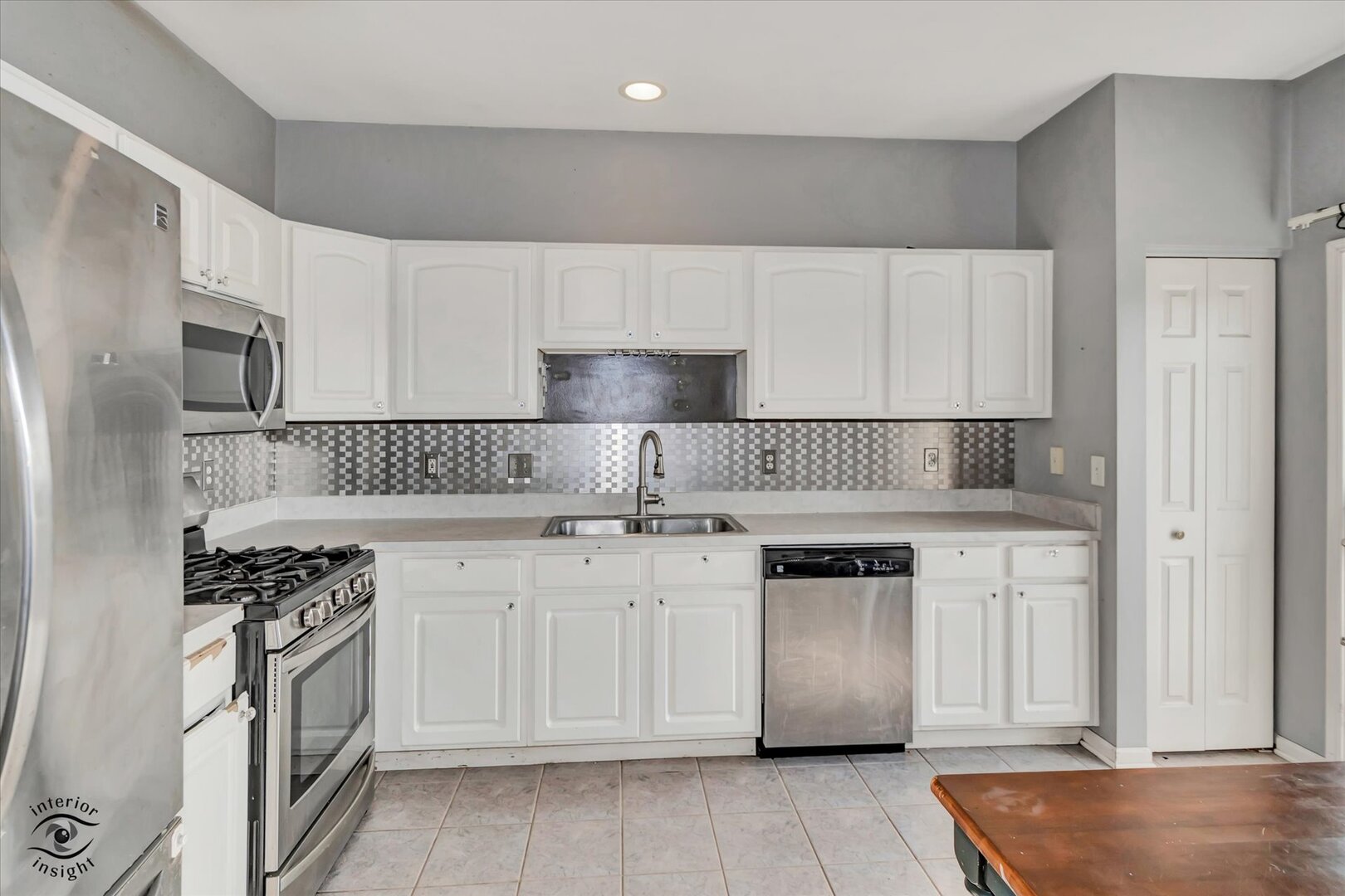 1831 South Wentworth Circle Romeoville, IL 60446 - Photo 8 of 23 a kitchen with granite countertop white cabinets and white appliances