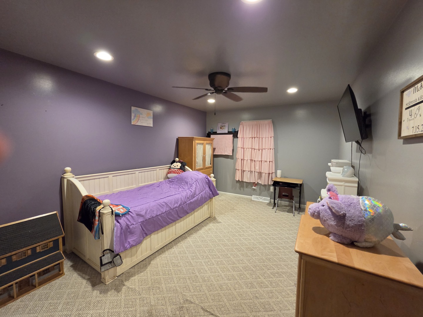 1000 West McKinley Road Ottawa, IL 61350 - Photo 14 of 19 a spacious bedroom with a bed a chandelier and a flat screen tv