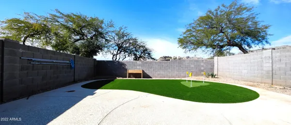 a view of a swimming pool and a yard