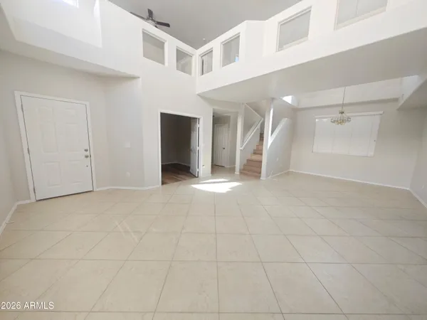 a view of a big room with closet and windows