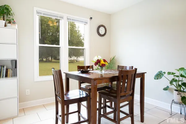a view of a dining room with furniture window and outside view