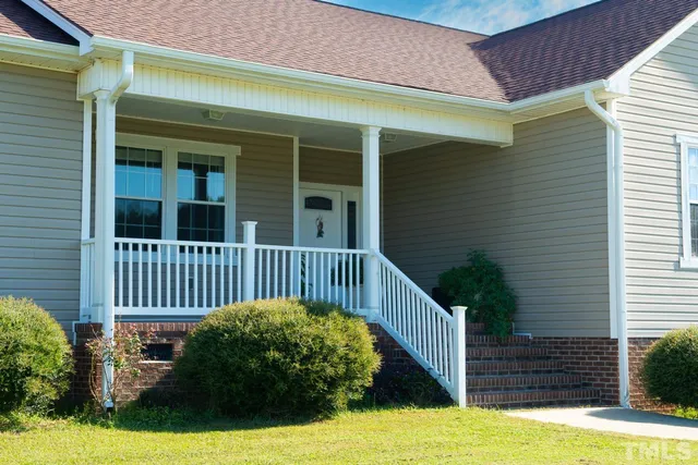 a view of a house with a small yard