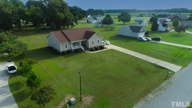 an aerial view of a house with a garden