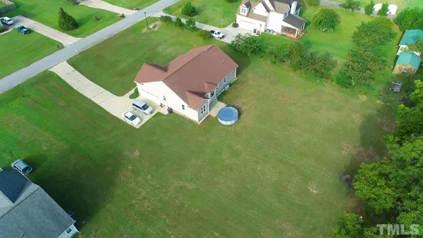 an aerial view of a house with a garden