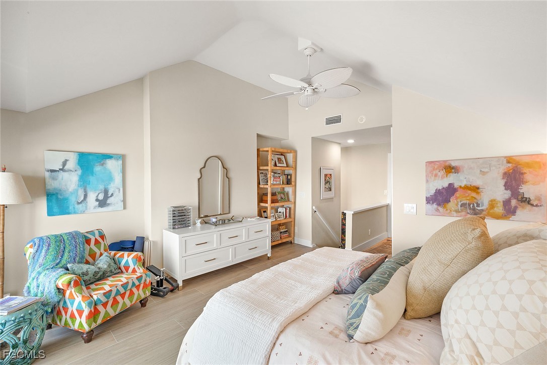 114 Useppa Island, Unit A Bokeelia, FL 33922 - Photo 20 of 44 a bedroom with bed and window