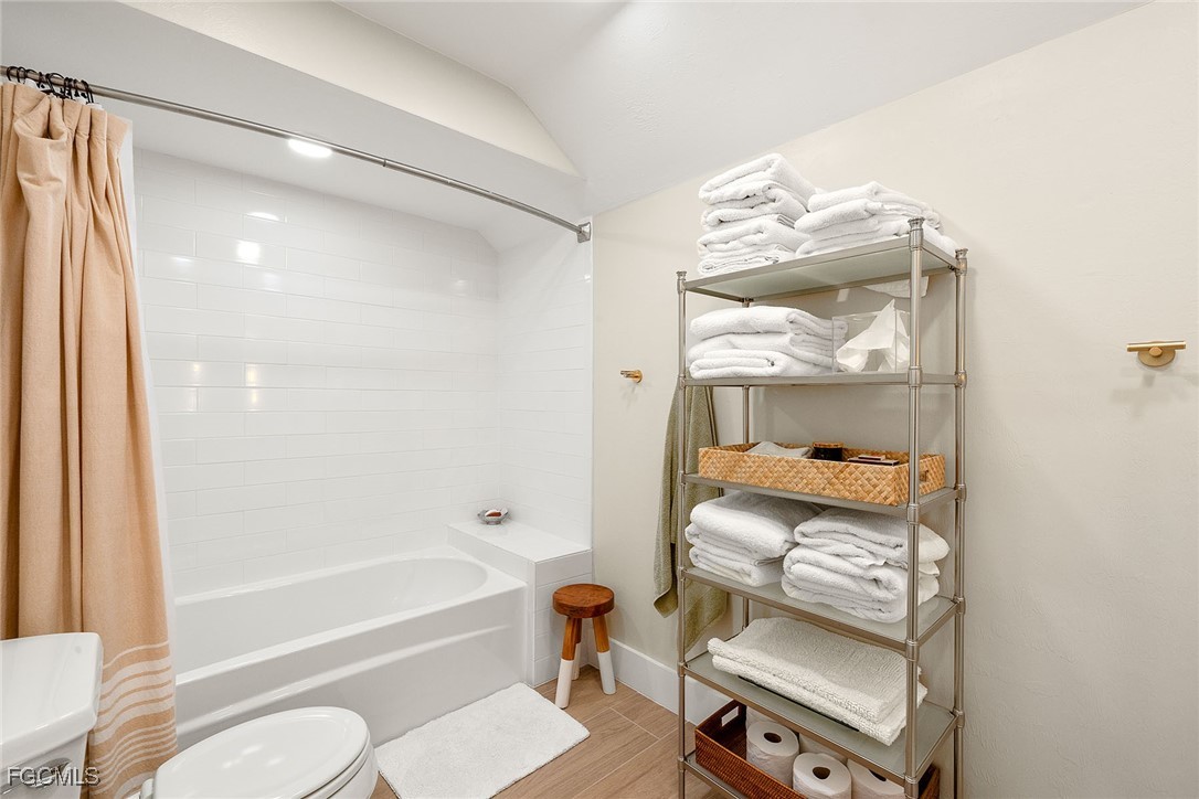 114 Useppa Island, Unit A Bokeelia, FL 33922 - Photo 23 of 44 a bathroom with a sink toilet and shower