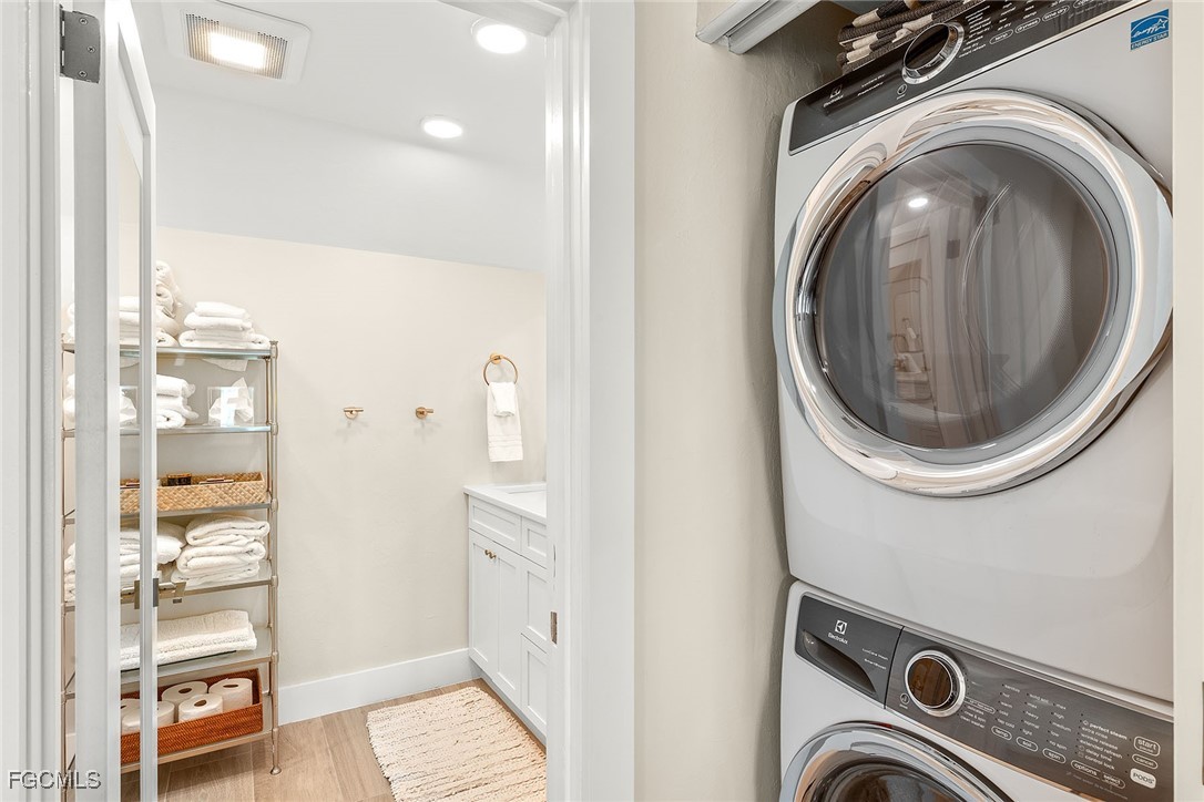 114 Useppa Island, Unit A Bokeelia, FL 33922 - Photo 26 of 44 a view of a bathroom with washing machine