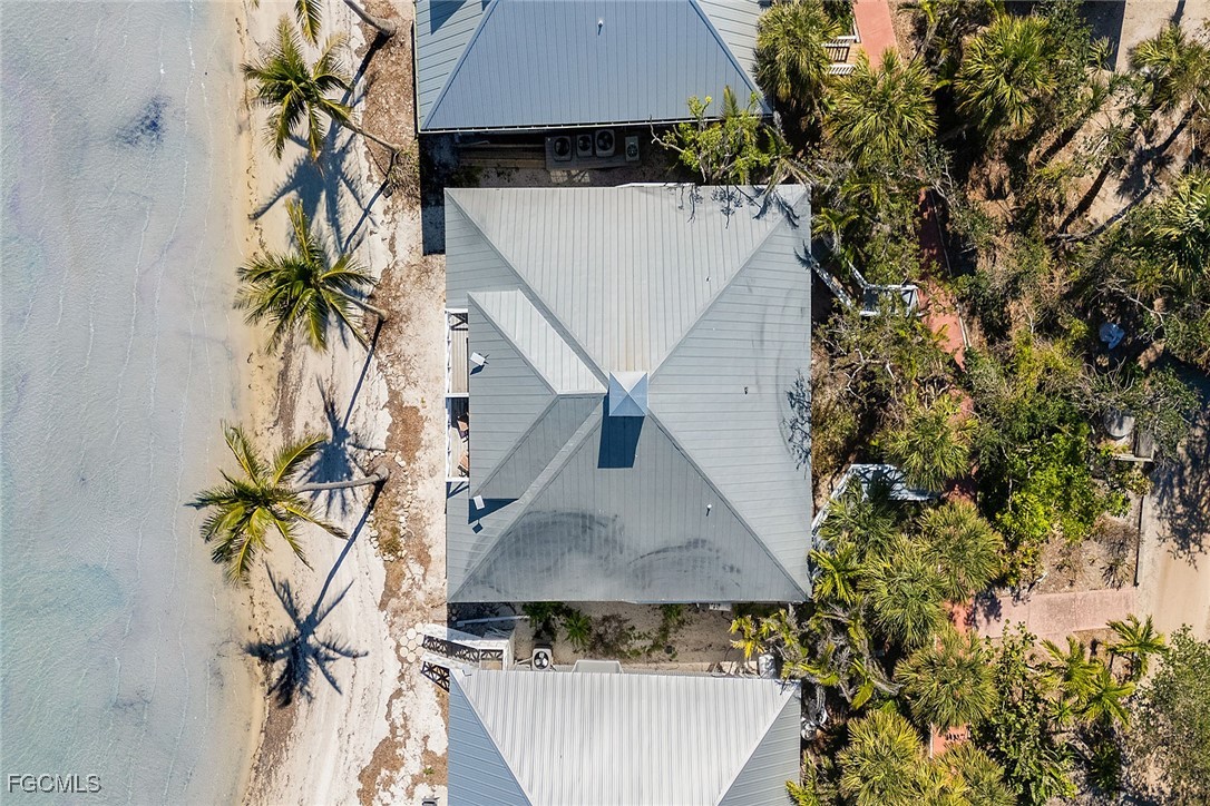 114 Useppa Island, Unit A Bokeelia, FL 33922 - Photo 38 of 44 an aerial view of a house with a yard