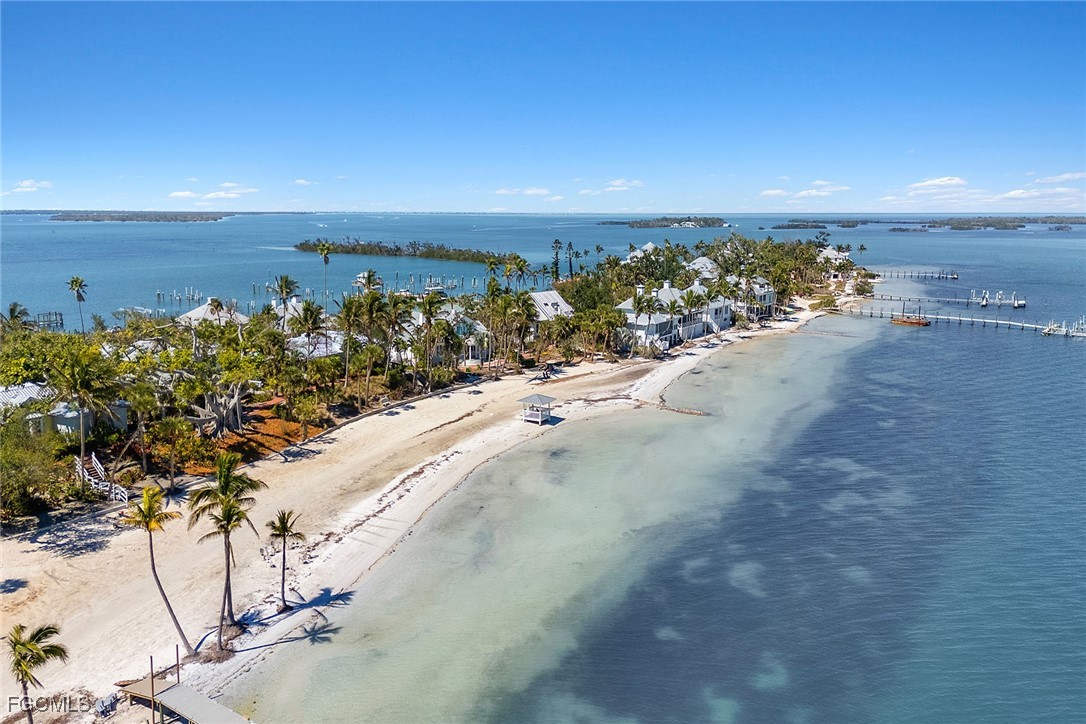 114 Useppa Island, Unit A Bokeelia, FL 33922 - Photo 44 of 44 a view of a lake with beach and ocean view