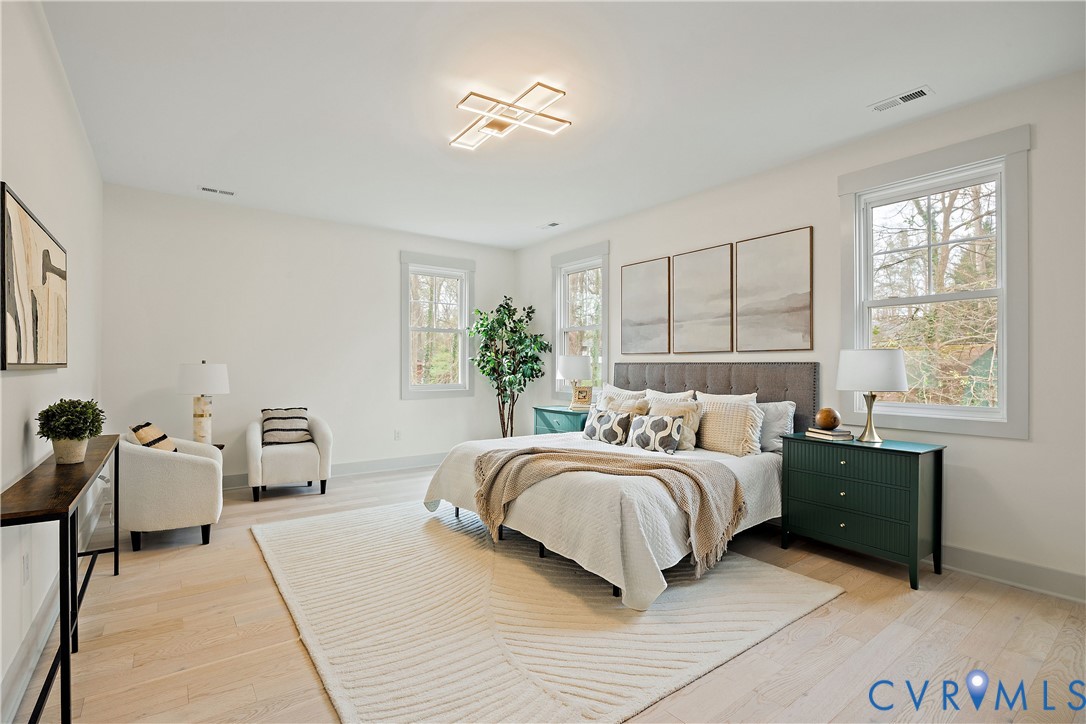 8919 Rustic Road Richmond, VA 23235 - Photo 21 of 36 2nd floor primary bedroom featuring light wood-fin