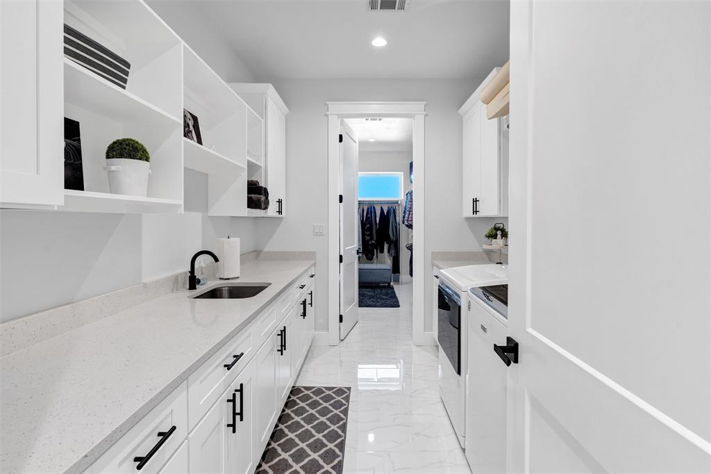 175 Bittersweet Trail Weatherford, TX 76088 - Photo 20 of 40 a kitchen with sink cabinets and stove