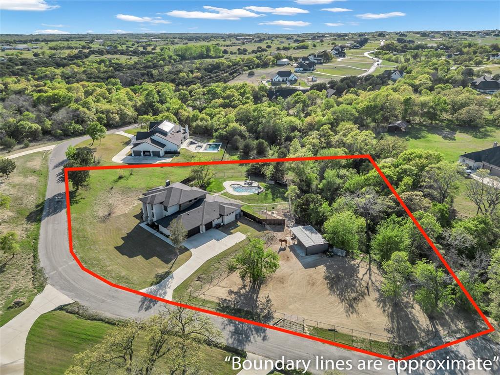 175 Bittersweet Trail Weatherford, TX 76088 - Photo 2 of 40 an aerial view of a house with a yard and lake view
