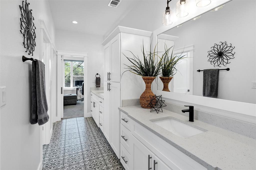 175 Bittersweet Trail Weatherford, TX 76088 - Photo 27 of 40 a bathroom with a sink a mirror and shower