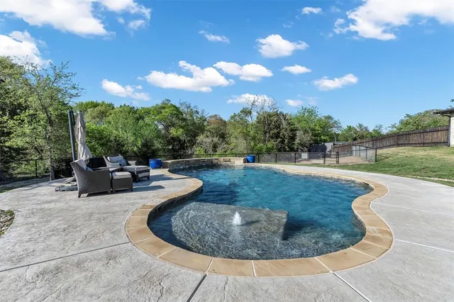 a view of a swimming pool with a sitting space